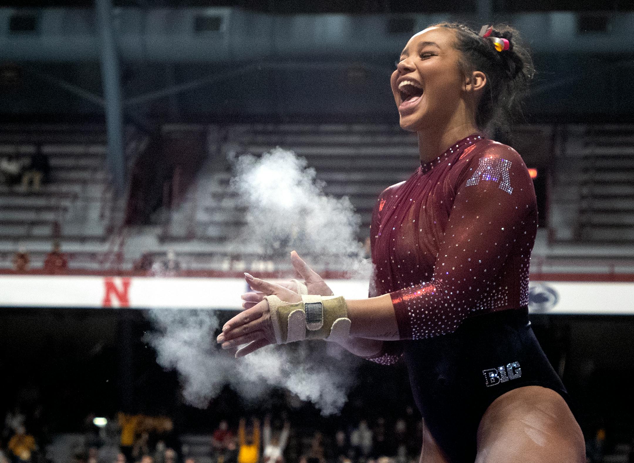Mya Hooten reacts after competing in the vault.