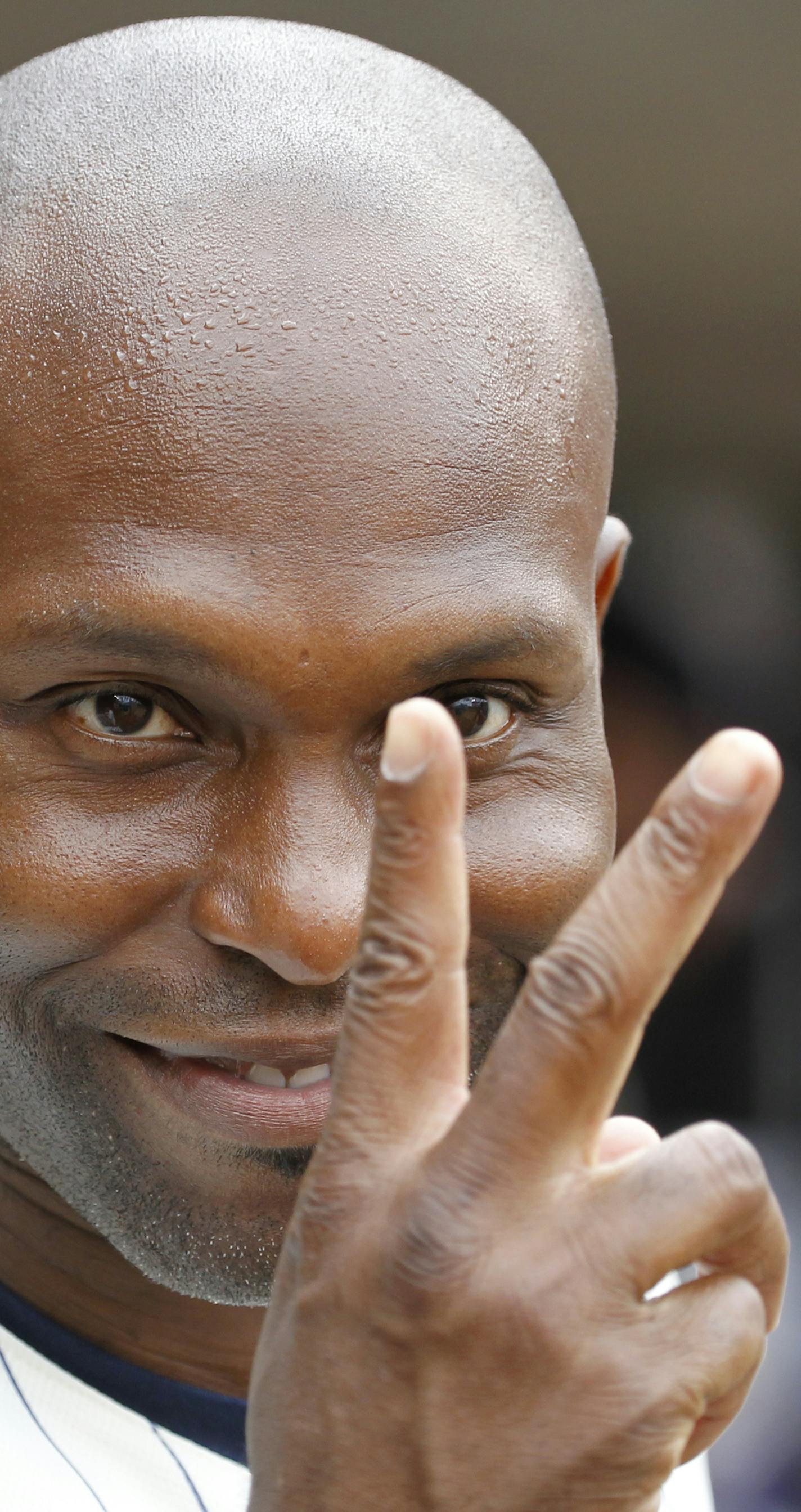 Minnesota Twins right fielder Torii Hunter gestures in the dugout before a baseball game against the New York Yankees in Minneapolis, Saturday, July 25, 2015. (AP Photo/Ann Heisenfelt)