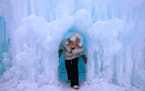 Zhenya Ratushko, 15, of Rochester, Minn. climbed out of an ice cave while exploring the Ice Castle Friday evening Excelsior.