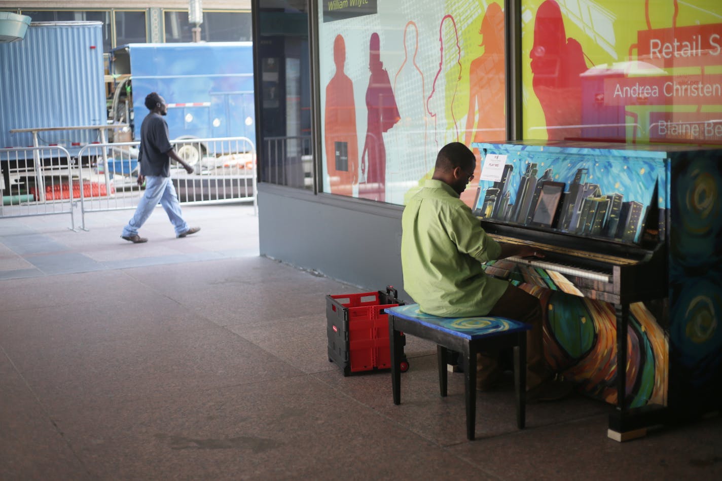 Walter Hampton of St. Paul plays a piano outside of the IDS Center on Wednesday, June 8, 2016. The piano, painted by artist Sam Basques, is one of 25 uniquely designed pianos available throughout Downtown Minneapolis during the month of June for the public to play through the month of June. ] Timothy Nwachukwu &#x2022; timothy.nwachukwu@startribune.com Pianos on Parade is a program produced by the Minneapolis Downtown Council and Minneapolis Downtown Improvement District in partnership with Keys