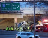 First responders attend to a crash scene on Highway 62 at 34th Ave. Monday, March 27, 2023 in Minneapolis.