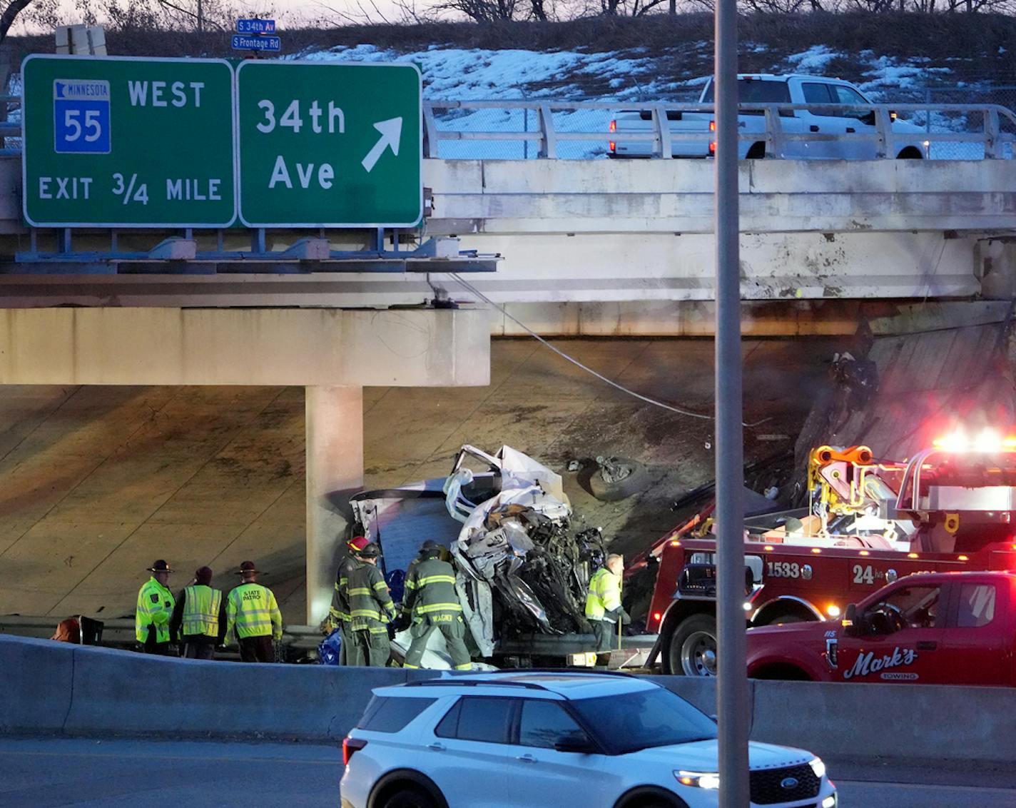 First responders attend to a crash scene on Highway 62 at 34th Ave. Monday, March 27, 2023 in Minneapolis.