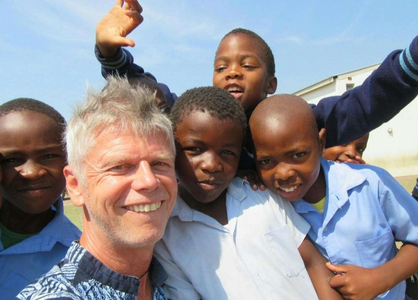 Henry Bromelkamp (center), a Minneapolis technologist and small business owner, also is the 14-year founder of Africa Classroom Connections, a nonprofit that has partnered with local rural communities in South Africa and Malawe to build and equip about 110 primary schools. The work continues despite Bromelkamp's 2019 head injury that has left him incapacitated and residing in an assited living facility. 2017 Photo: African Classroom Connection