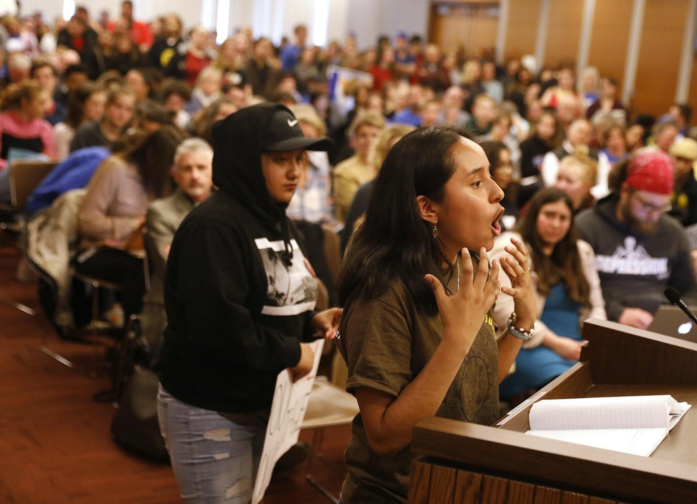 Ashley Ortega-Cano, a freshman at Southwest High School, speaks during the public comment period about potential cuts to a Chicano Latino cultural studies class at her school. ] LEILA NAVIDI &#xef; leila.navidi@startribune.com BACKGROUND INFORMATION: Parents, students, staff and teachers upset about proposed budget cuts to their individual schools speak during a public comment period at a Minneapolis School Board meeting at the Davis Center in Minneapolis on Tuesday, April 10, 2018.