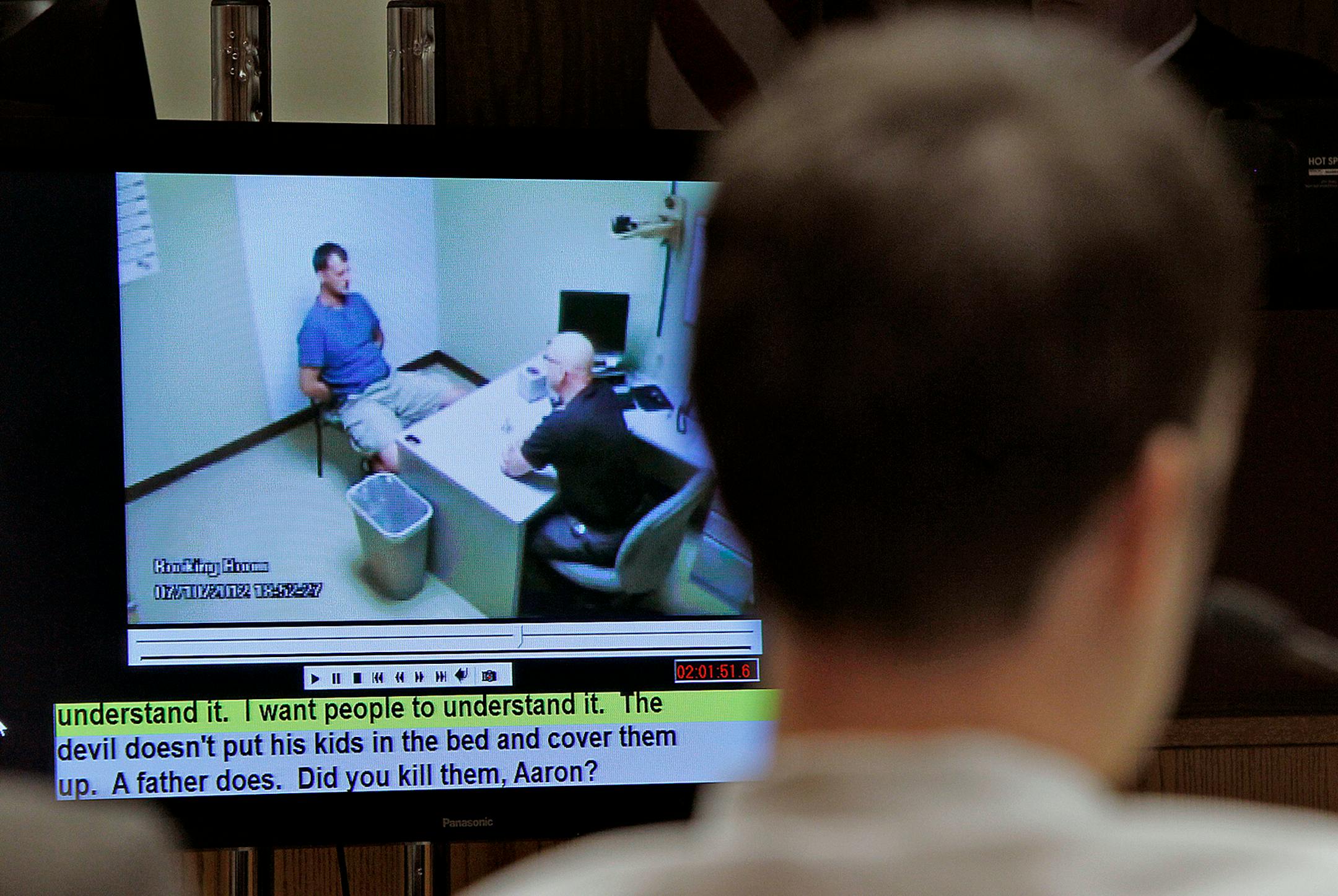 Aaron Schaffhausen and jurors watched a video as River Falls Police Detective Charles Golden did the initial interrogation during the second day of trial at a St. Croix County Courtroom in Hudson, Wis., Wednesday, April 3, 2013.