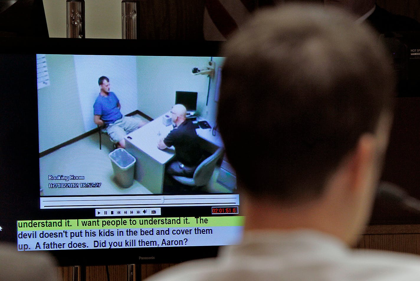 Aaron Schaffhausen and jurors watched a video as River Falls Police Detective Charles Golden did the initial interrogation during the second day of trial at a St. Croix County Courtroom in Hudson, Wis., Wednesday, April 3, 2013.