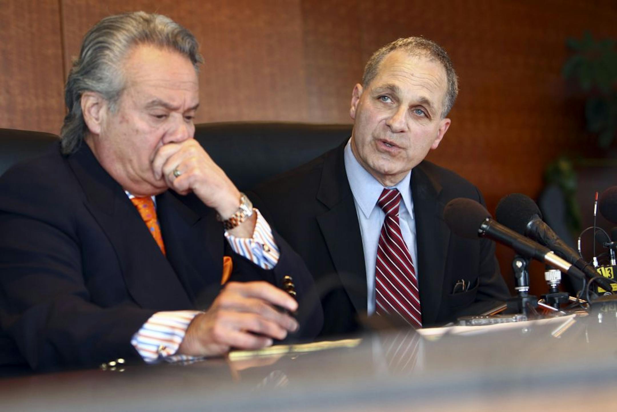 Attorney Louis Freeh, the former FBI chief, said the allegations were "entirely false." At left is lawyer Robert Weinstine, who also was part of businessman Nasser Kazeminy's legal team.
