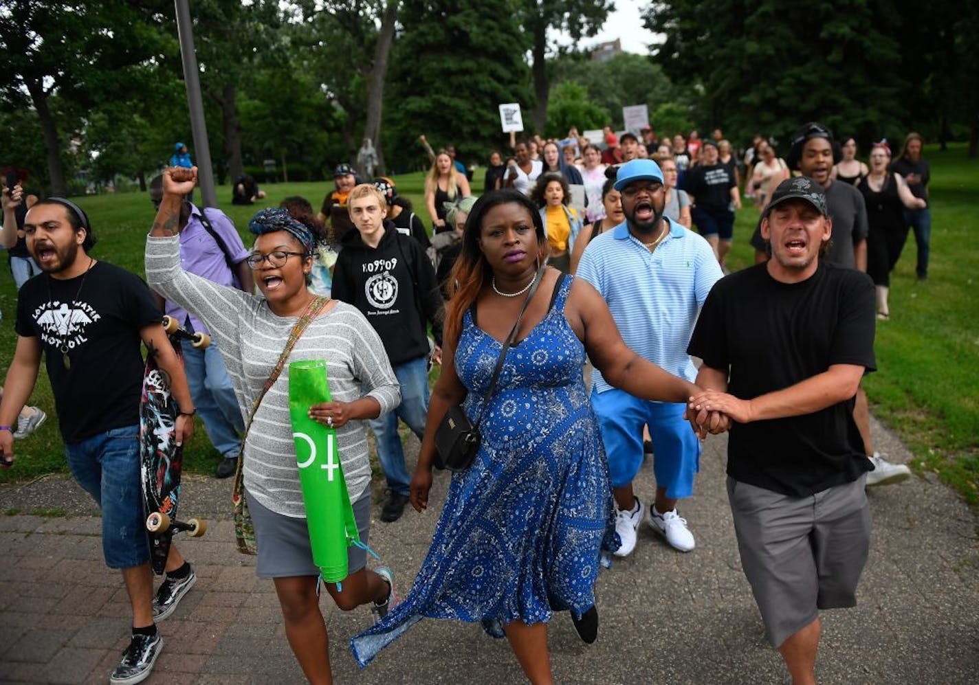 Nekima Levy Pounds led marchers through Loring Park Saturday afternoon.