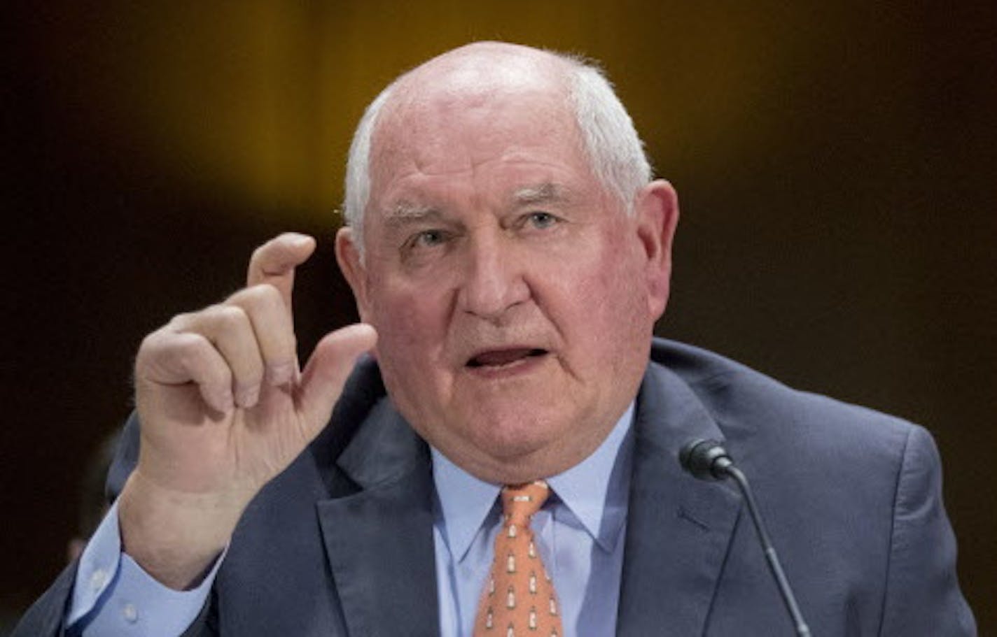 Agriculture Secretary Sonny Perdue, left, accompanied by Energy Secretary Rick Perry, right, speaks during a Senate Committee on Commerce, Science, & Transportation hearing on infrastructure on Capitol Hill in Washington, Wednesday, March 14, 2018. (AP Photo/Andrew Harnik)