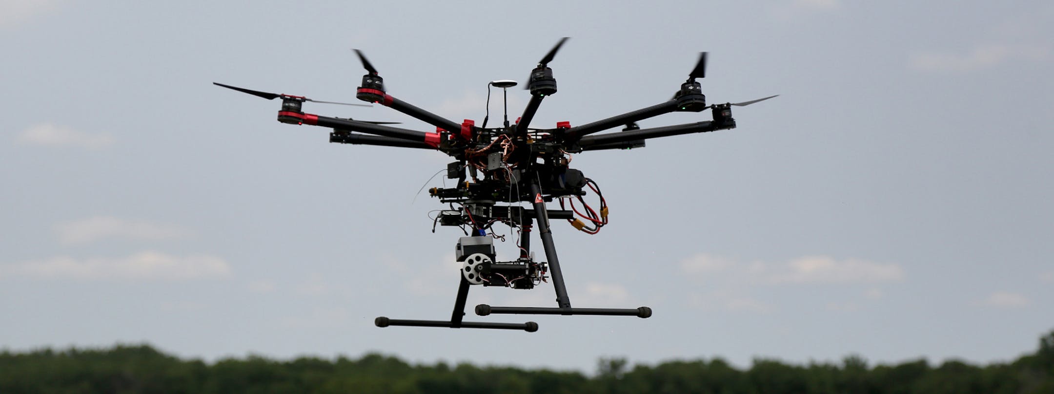 This DJIS-1000 hovered as to landed after a test flight. ] (KYNDELL HARKNESS/STAR TRIBUNE) kyndell.harkness@startribune.com University of Minnesota researchers are testing how well drones, or unmanned aircraft systems, detect insects like soybean aphids and potato beetles. in Rosemount, Min., Thursday, July 7, 2015. ORG XMIT: MIN1507071424400151