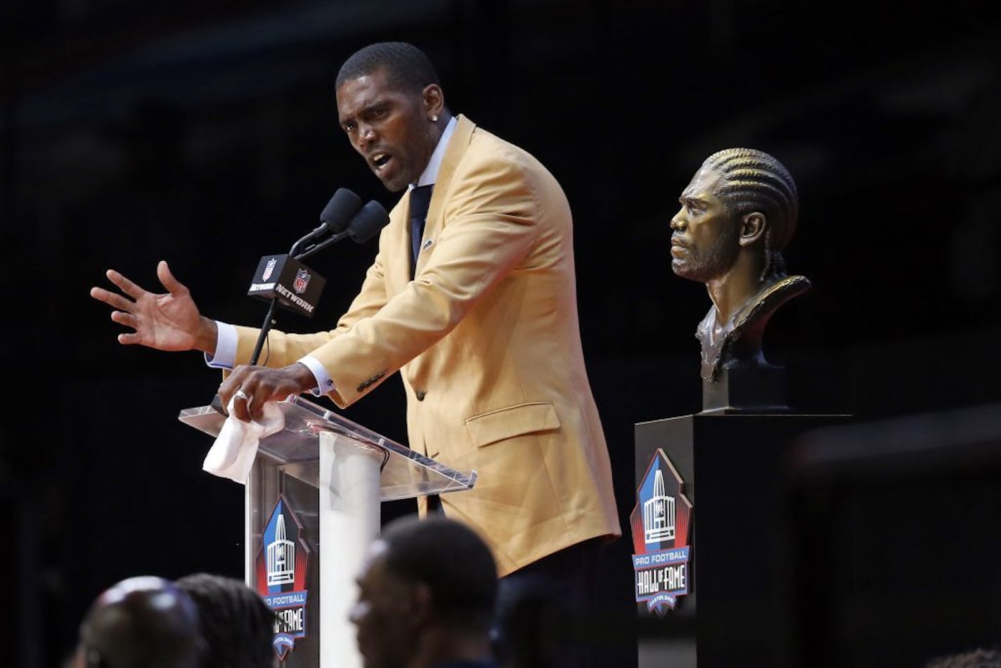 Former NFL player Randy Moss gives his speech during an induction ceremony at the Pro Football Hall of Fame Saturday, Aug. 4, 2018, in Canton, Ohio.