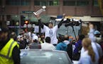 Janel McCarville of the Minnesota Lynx held up the trophy at the start of the championship celebration parade for the WNBA champions in 2013.