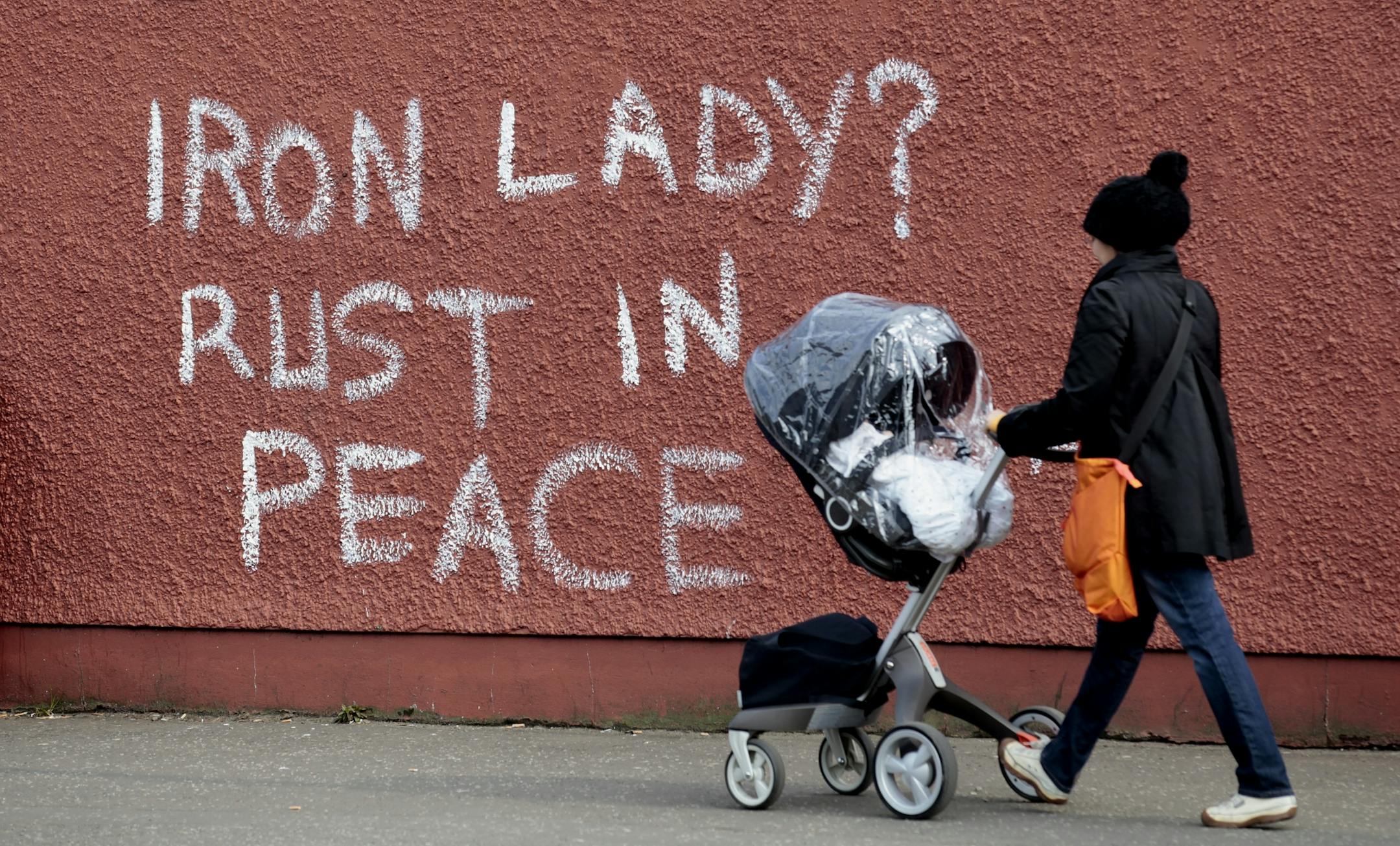 Anti-Margaret Thatcher graffiti adorns a wall on the Falls Road in west Belfast, Northern Ireland, April 9, 2013. The former prime minister died on Monday aged 87 after suffering a stroke while staying at the Ritz hotel in central London. Later on Monday, "street parties" were held in Londonderry and west Belfast as well as other parts of Britain.