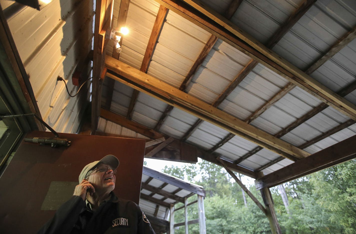 Bug-O-Nay-Ge-Shig security guard and grounds supervisor John Parmeter looks up at roof rafters that had been scabbed together on an overhang of the high school roof that was severely damaged the season before by the weight of heavy snow and ice Monday, Sept. 8, 2014, in Bena, MN.](DAVID JOLES/STARTRIBUNE)djoles@startribune The Bug O Nay Ge Shig School is a culturally based alternative school that opened in 1975 with a mission of serving Ojibwe children and has matured into a fully accredited edu