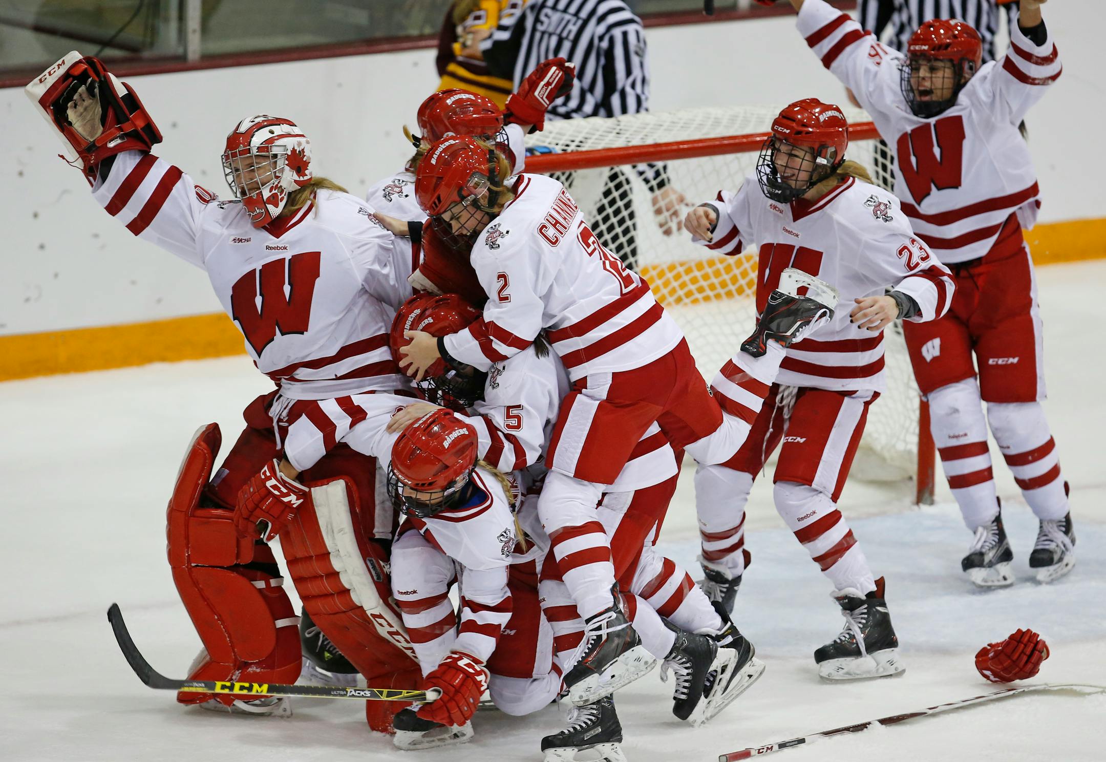 The Wisconsin Badgers rushed goalie Ann-Renee Desbiens, who made 35 saves, to celebrate their 1-0 shutout victory in the WCHA women's hockey tournament championship at Ridder Arena on Sunday.