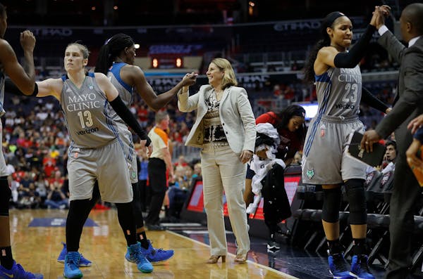 Lynx head coach Cheryl Reeve greets Sylvia Fowles as other members of the team celebrate during a game last postseason.