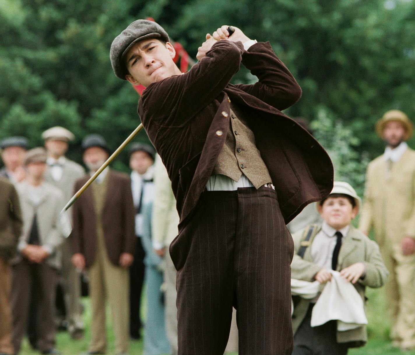 Shia LaBeouf, center, Josh Flitter, center right are shown in this undated promotional still from the film "The Greatest Game Ever Played." The Walt Disney Co. is marketing the movie to faith-based groups even though the film, about Francis Ouimet's improbable win in the 1913 U.S. Open, isn't overtly religious. (AP Photo/The Walt Disney Co., Jonathan Wenk)