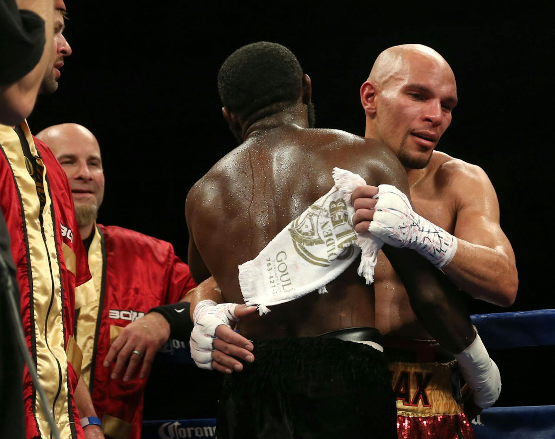 Ossie Duran aka - The Ghanaian Gladiator and USBA Middleweight Champion Caleb Truax, of Osseo, Minnesota congratulated each other after a semi final fight at Target Center in Minneapolis Friday, January 3, 2014. The bout ended in a tie 95-95. ] (KYNDELL HARKNESS/STAR TRIBUNE) kyndell.harkness@startribune.com