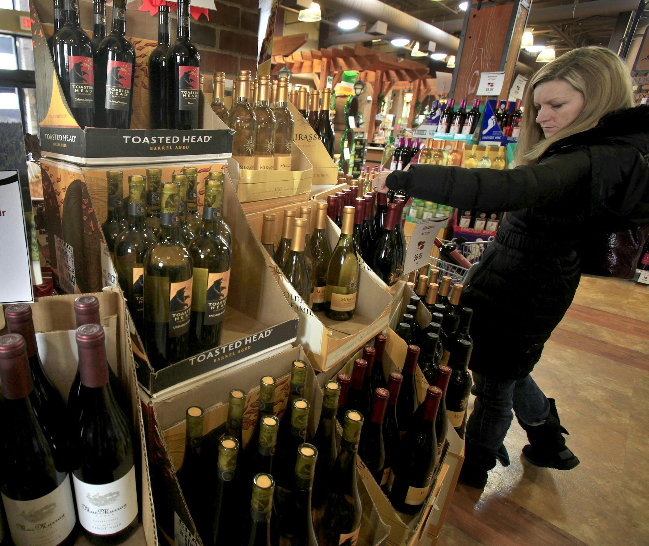 Tami Ross of Lakeville, Mn shopped for wine at the Lakeville Municipal Liquor Store. Lakeville, MN on March 12, 2013. ] JOELKOYAMA‚Ä¢joel koyama@startribune.com There are several bills in the House and Senate related to Sunday liquor sales, including one authored by Rep. Pat Garofalo of district 58B/Farmington which asks that Sunday liquor sales be allowed only on Superbowl Sunday 2014. With the Minnesota public generally in favor of Sunday liquor sales and liquor store owners a