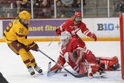 Gophers forward Abbey Murphy took a shot against Wisconsin goalie Jane Gervais during the rivals' series in December.