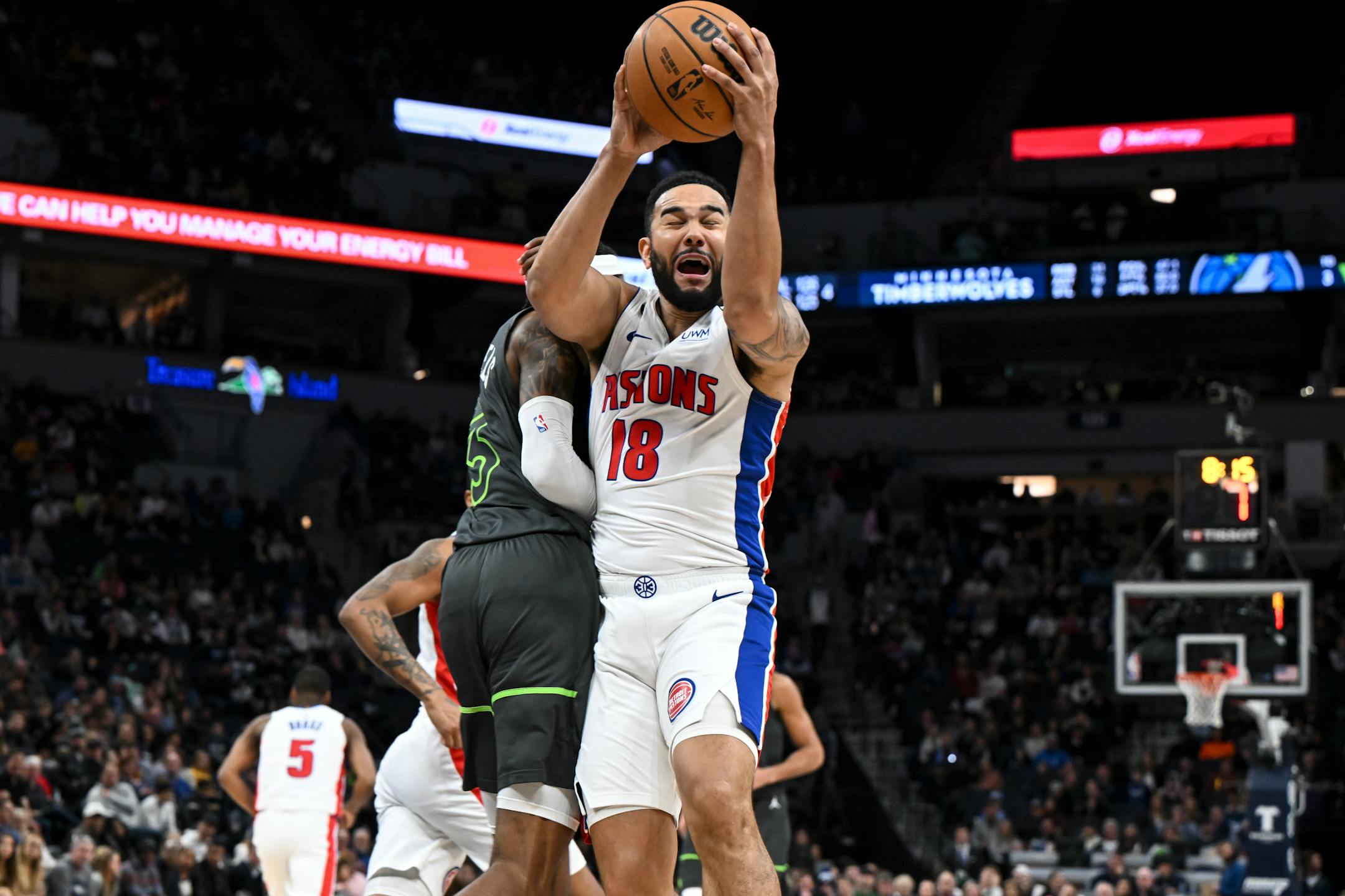 Minnesota Timberwolves forward Jaden McDaniels (3) is called for a foul after colliding with Detroit Pistons guard Cory Joseph (18) during the second half.
