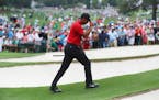 Tiger Woods tipped his cap as he walked to the green at No. 7 during the final round of the Masters on Sunday. At age 43, he slipped on his first gree