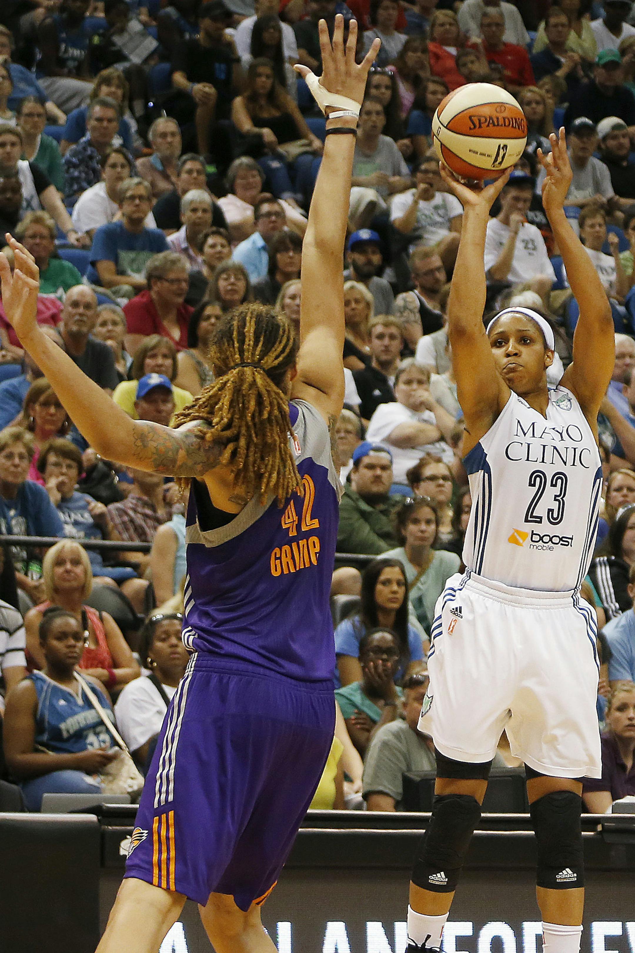Minnesota Lynx forward Maya Moore (23) lines up a shot against Phoenix Mercury center Brittney Griner (42) in the second half of a WNBA basketball game, Thursday, July 31, 2014, in Minneapolis. The Lynx won 75-67. (AP Photo/Stacy Bengs)