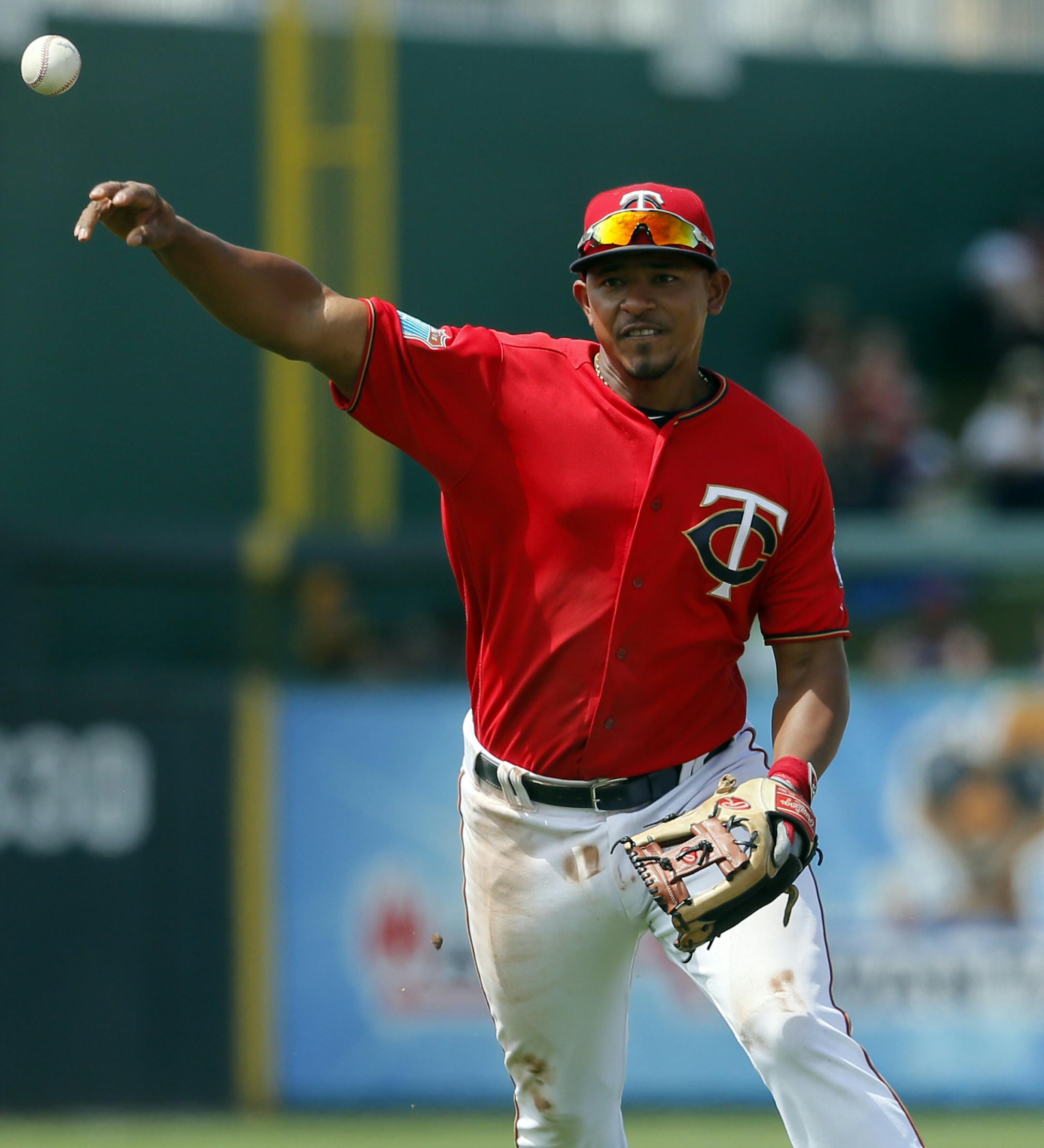 Minnesota Twins shortstop Eduardo Escobar throws to first during a spring training baseball game against the Pittsburgh Pirates on Monday, March 21, 2016, in Fort Myers, Fla. (AP Photo/Tony Gutierrez)
