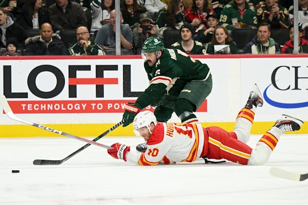 Wild outlast Flames in shootout to stay hot after coaching change