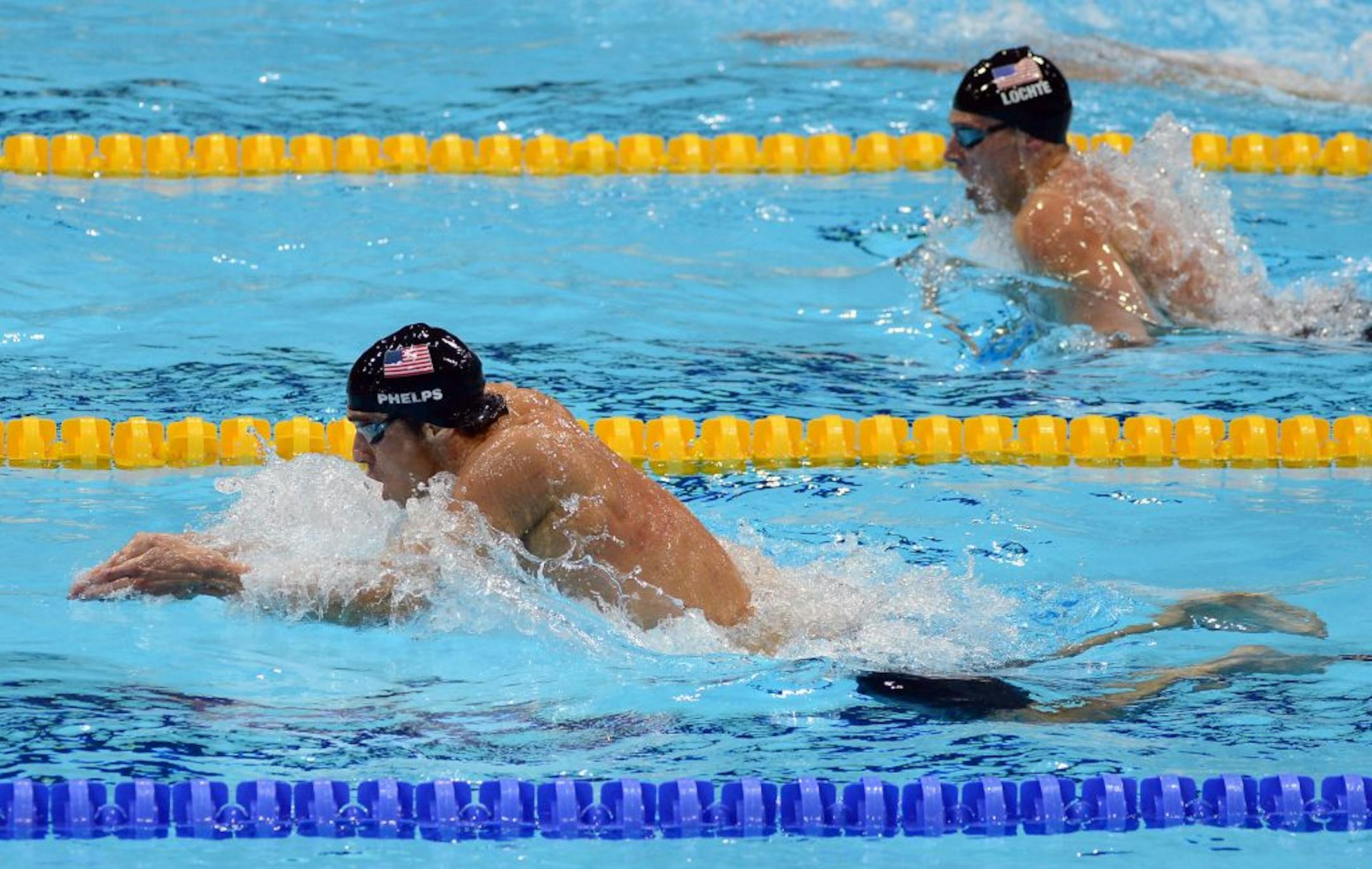 Michael Phelps, left, and Ryan Lochte raced in the breaststroke portion of the men's 200-meter individual medley on Thursday, with Phelps on his way to winning the gold medal and Lochte silver.