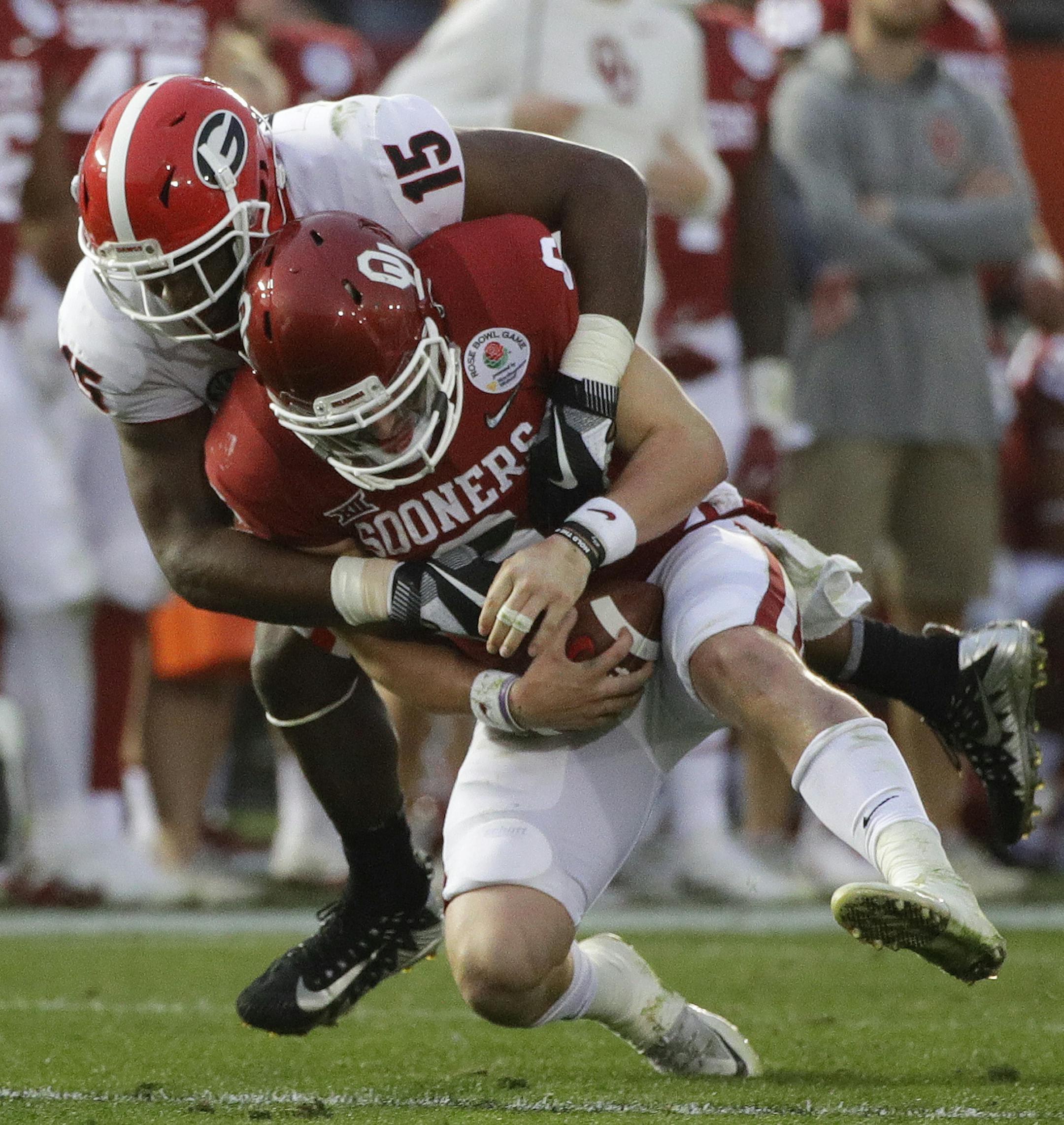 Oklahoma quarterback Baker Mayfield (6) is sacked by Georgia linebacker D'Andre Walker (15), during the second half of the Rose Bowl NCAA college football game, Monday, Jan. 1, 2018, in Pasadena, Calif.(AP Photo/Jae C. Hong)