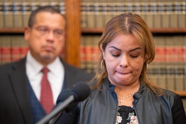 Manuela Enriquez, 43, from Burnsville, Minn., speaks during a press conference at the Attorney General’s Office inside the Minnesota State Capitol i