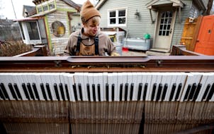 Nate Otto disassembled a player piano in his backyard on December 19, 2023, in Anoka.