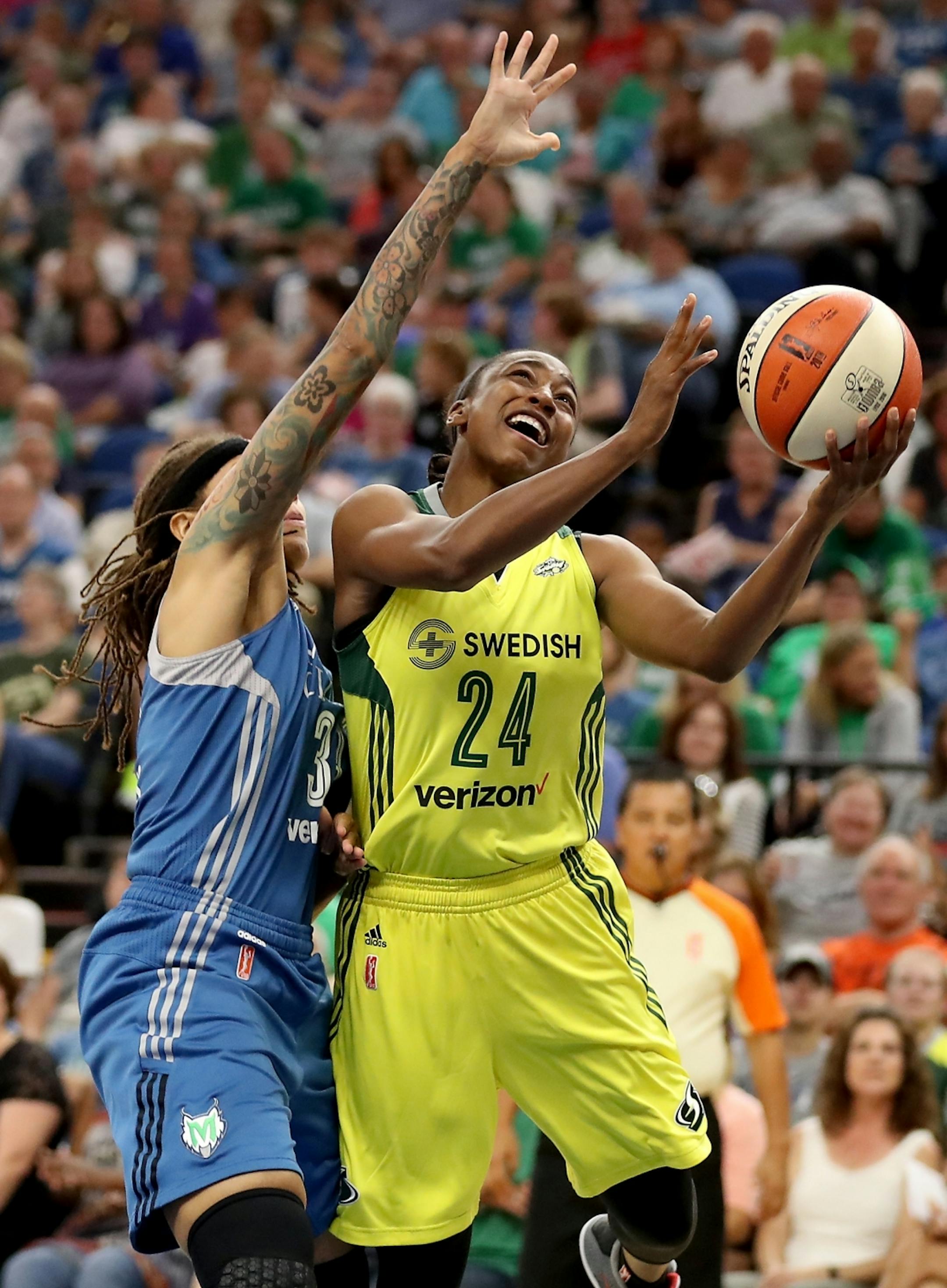 Seattle Storm guard Jewell Loyd (24) shoots against Minnesota Lynx guard Seimone Augustus (33) during the first half.