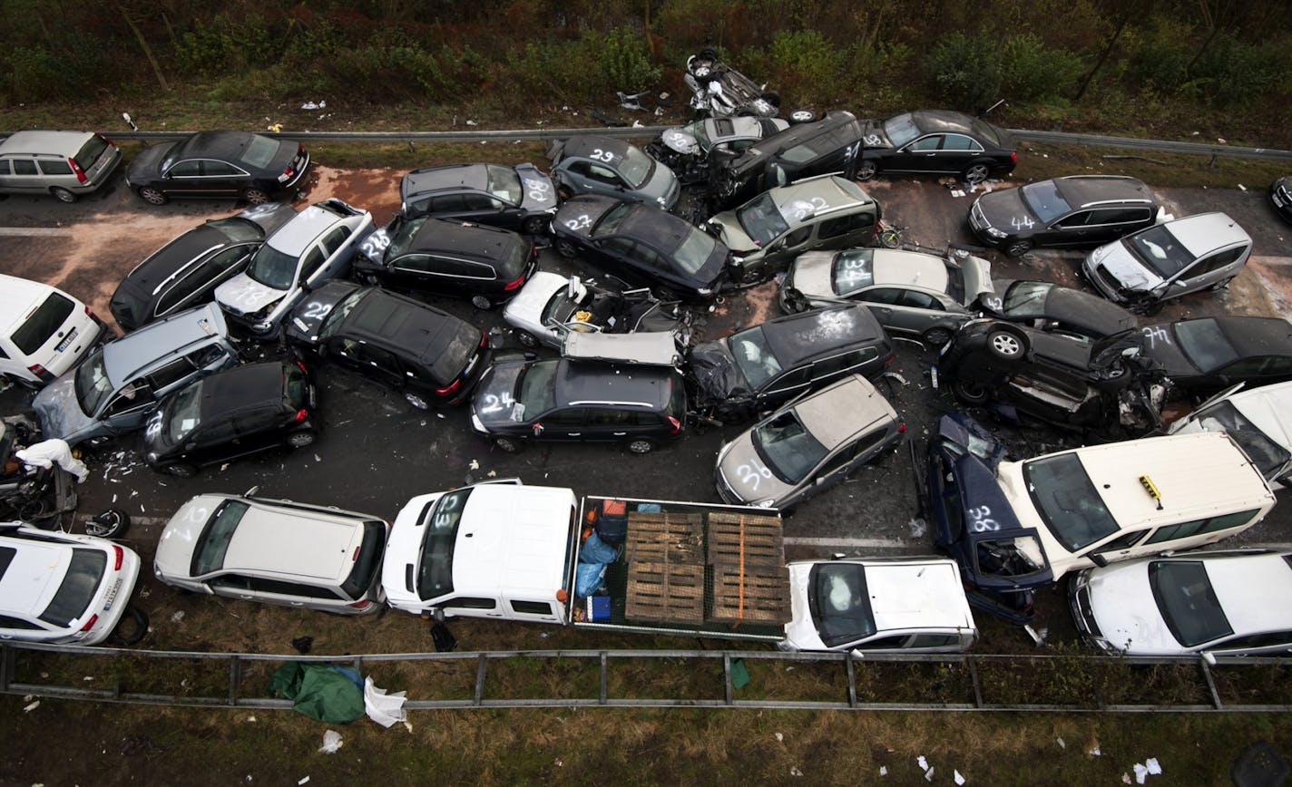 An autobahn pileup is seen near Gronau, northern Germany Saturday, Nov. 19, 2011. Police say a 52-vehicle pileup on the highway in northwestern Germany has left three people dead and 35 injured. The accident happened Friday evening on the A31 autobahn near the town of Gronau, on Germany's border with the Netherlands. The weather was foggy at the time but it wasn't immediately clear what triggered the pileup.