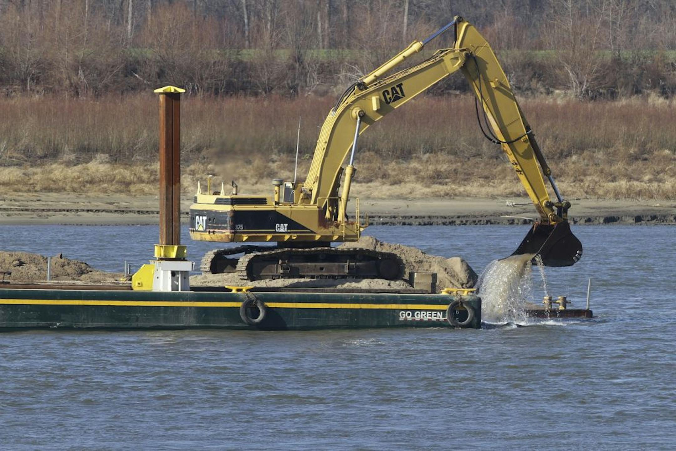 Excavating machinery aboard barges removed rocks from the Mississippi River last month at Thebes Ill. Drought has prompted such efforts to deepen the river.