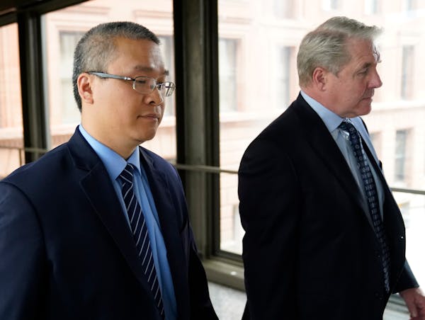 Former Minneapolis police officer Tou Thao, left, and his attorney Robert Paule arrived for sentencing for violating George Floyd’s civil rights at 