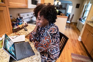 Business consultant Karen DeYoung held a video conference with her staff from her kitchen. She said she's has connected with other small business owne