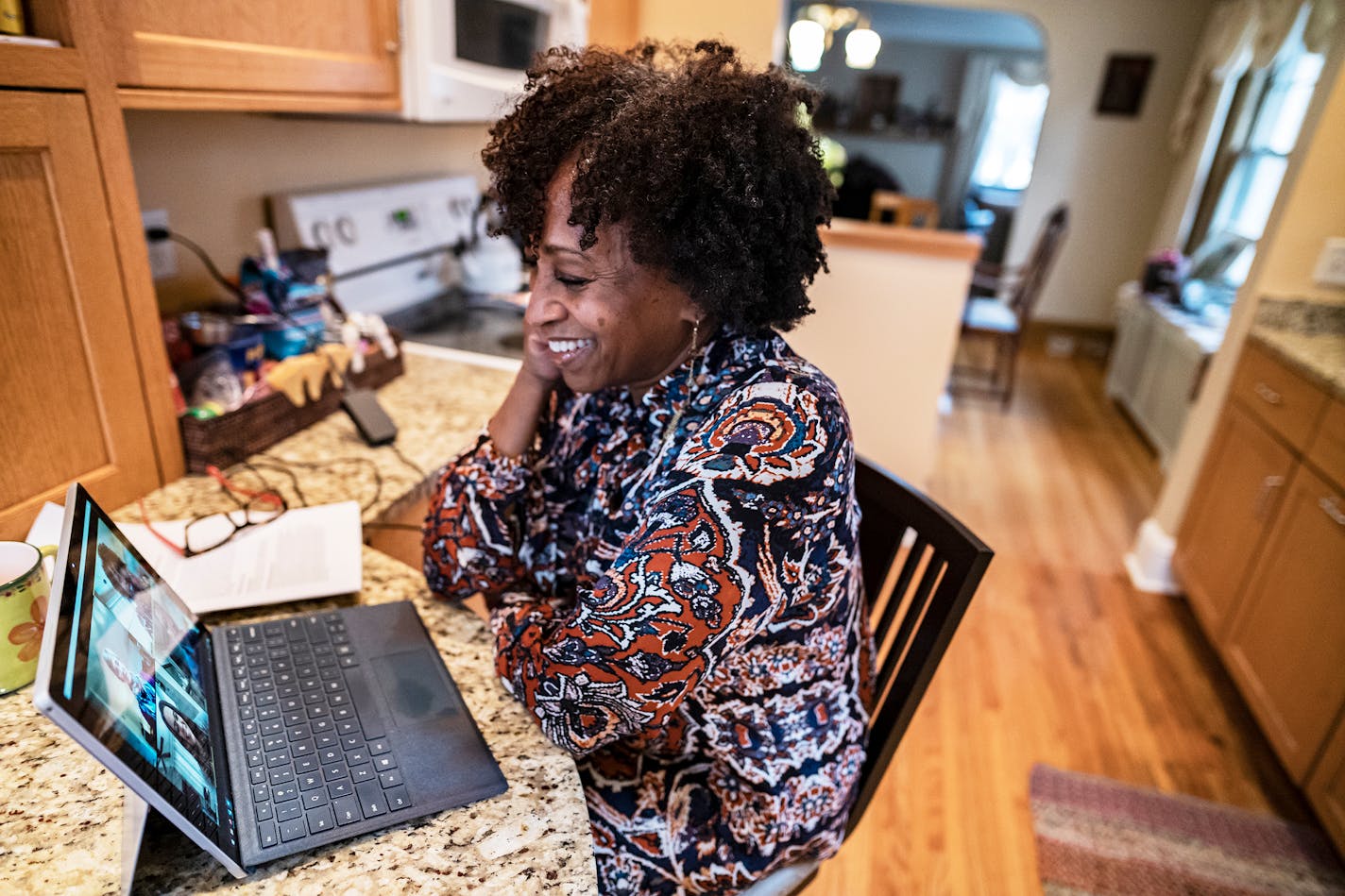 Business consultant Karen DeYoung held a video conference with her staff from her kitchen. She said she's has connected with other small business owners to share ideas.