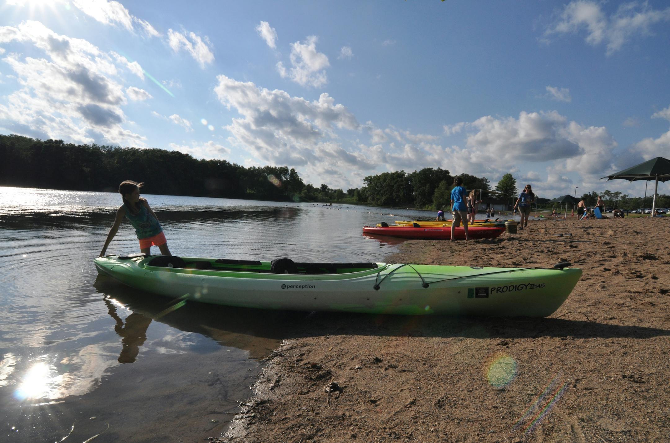 Photo by Liz Rolfsmeier 15: Emma Howard, 8, of Farmington, studied the parts of a kayak at a parent-child class at Lebanon Hills Regional Park.