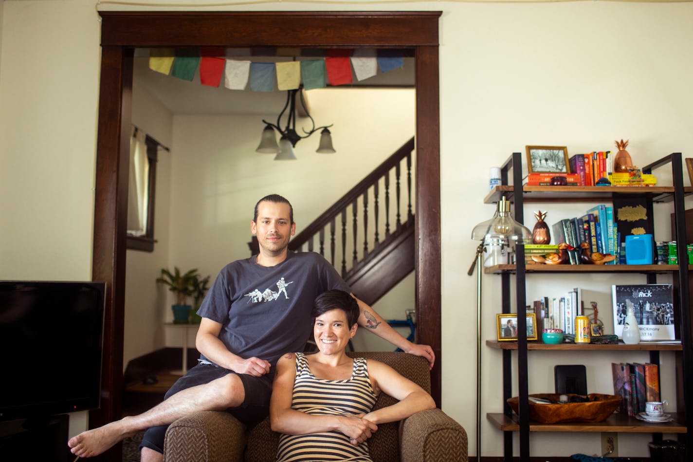 Robin Viele and her husband Nick Aspholm are photographed in their living room. ] NICOLE NERI • nicole.neri@startribune.com BACKGROUND INFORMATION: Robin Viele and her husband Nick Aspholm (with a baby on the way) along with their dogs Leo and Willow in their home Saturday, July 6, 2019.