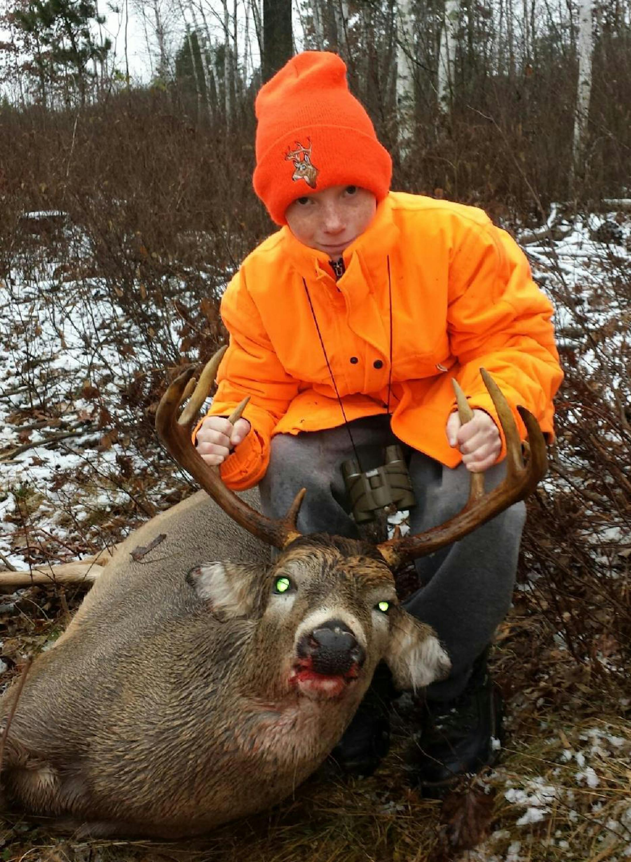 Tommy McNamara, 11, Bloomington, with a 10-point buck he shot opening morning near Longville.