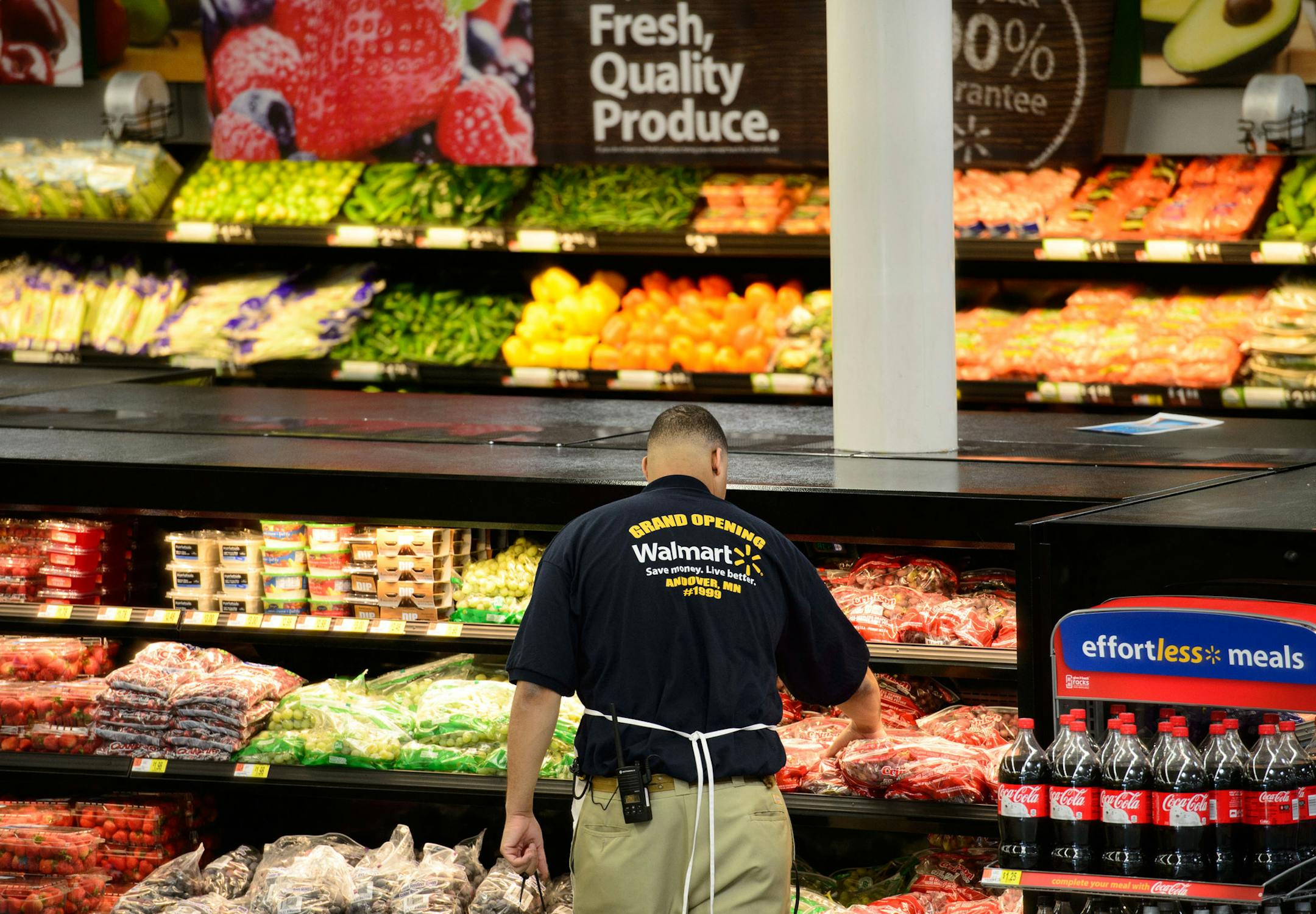 An associate kept the produce displays well stocked on opening day. Walmart associates wore Grand Opening shirts on opening day at the new Andover Walmart, Wednesday, November 13, 2013. ] GLEN STUBBE * gstubbe@startribune.com