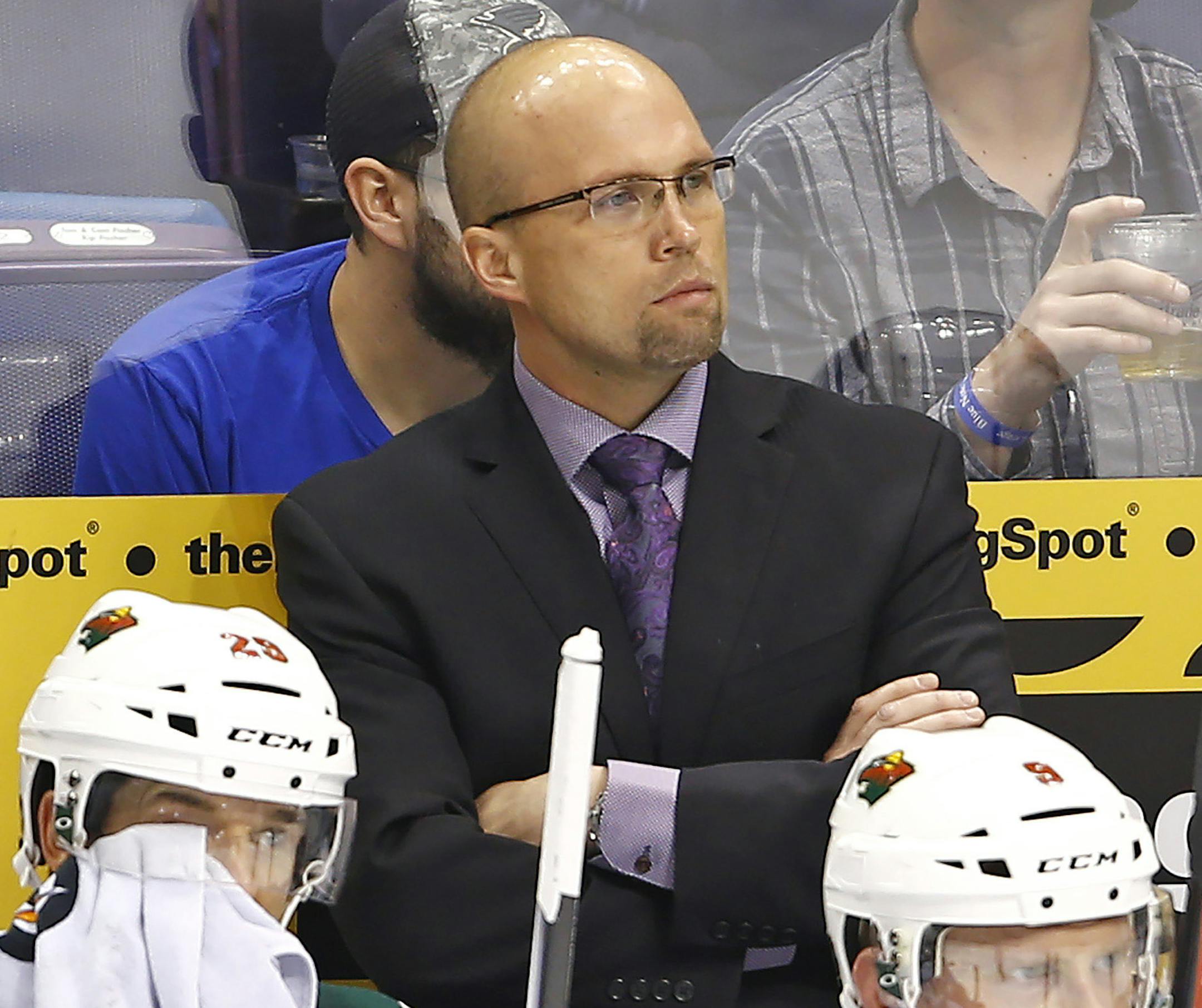 April 016, 2015 St. Louis, MO: Minnesota Wild head coach Mike Yeo watches his team from the bench during the first period against the St. Louis Blues in Game One of the Western Conference Quarterfinals of the 2015 NHL Stanley Cup Playoffs at Scottrade Center. (Cal Sport Media via AP Images) ORG XMIT: CSMAP