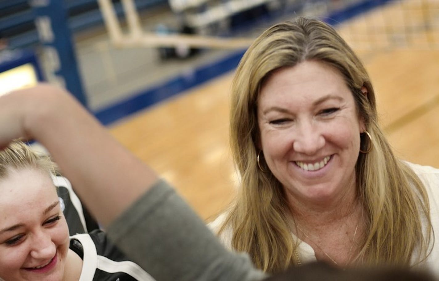 Hopkins junior setter Tara Lee and her aunt Vicki Seliger Swenson enclose a close and intense relationship during games.] Hopkins junior setter Tara Lee had her mother murdered in a highly-publicized domestic violence incident 10 years ago. Her aunt, Hopkins coach Vicki Seliger Swenson and husband Erik Swenson, took Tara and her siblings in and raised them. Tara is now the starting setter for Hopkins, one of the best teams in the state.Richard Tsong-Taatarii/rtsong-taatarii@startribune.com