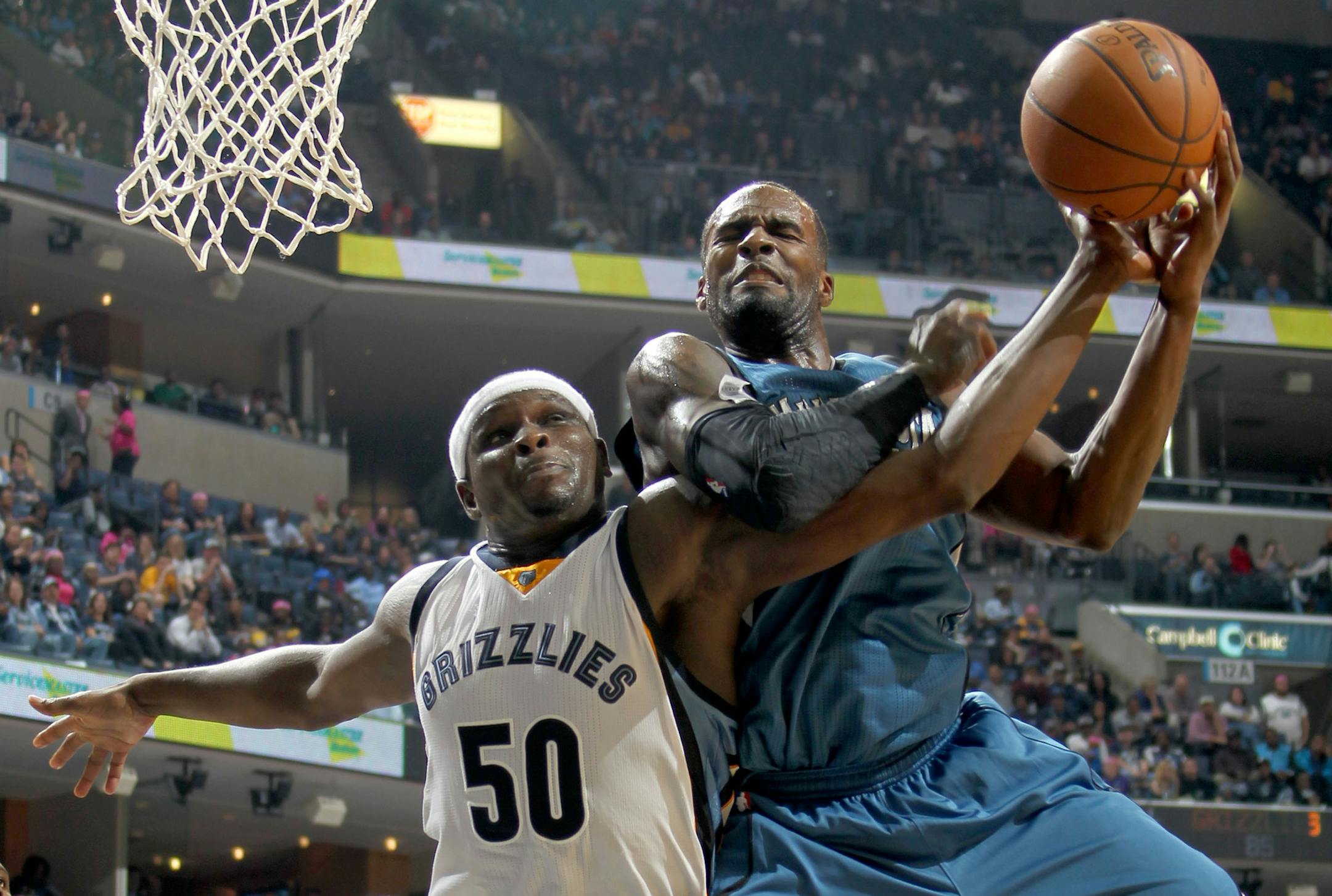 The Memphis Grizzlies' Zach Randolph (50) battles for a rebound with the Minnesota Timberwolves' Shabazz Muhammad at FedExForum in Memphis, Tenn., on Wednesday, Oct. 29, 2014. The Grizzlies won, 105-101. (Nikki Boertman/The Commercial Appeal/MCT)