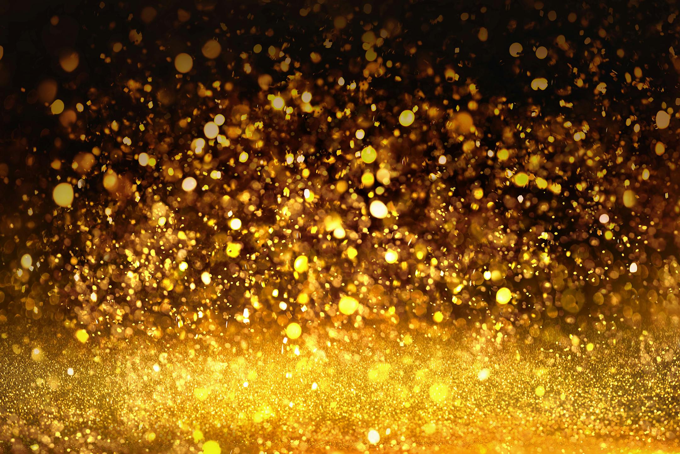 golden glitter texture Colorfull Blurred abstract background for birthday, anniversary, wedding, new year eve or Christmas.