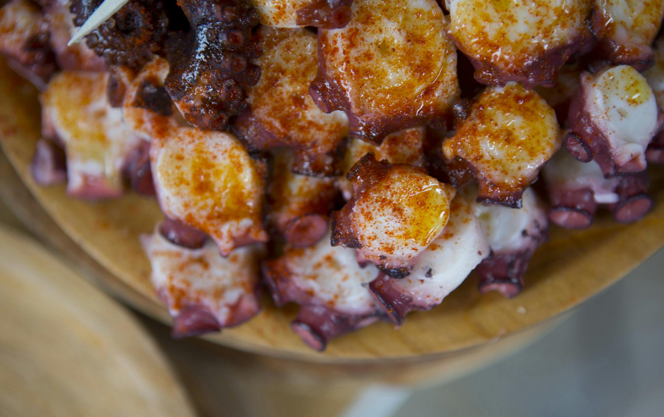 Photo by Mirra Fine, The Perennial Plate One of the best dishes we had in Spain was this Octopus in Galicia. Boiled in a copper pot and then served with olive oil and paprika. Not to be missed.