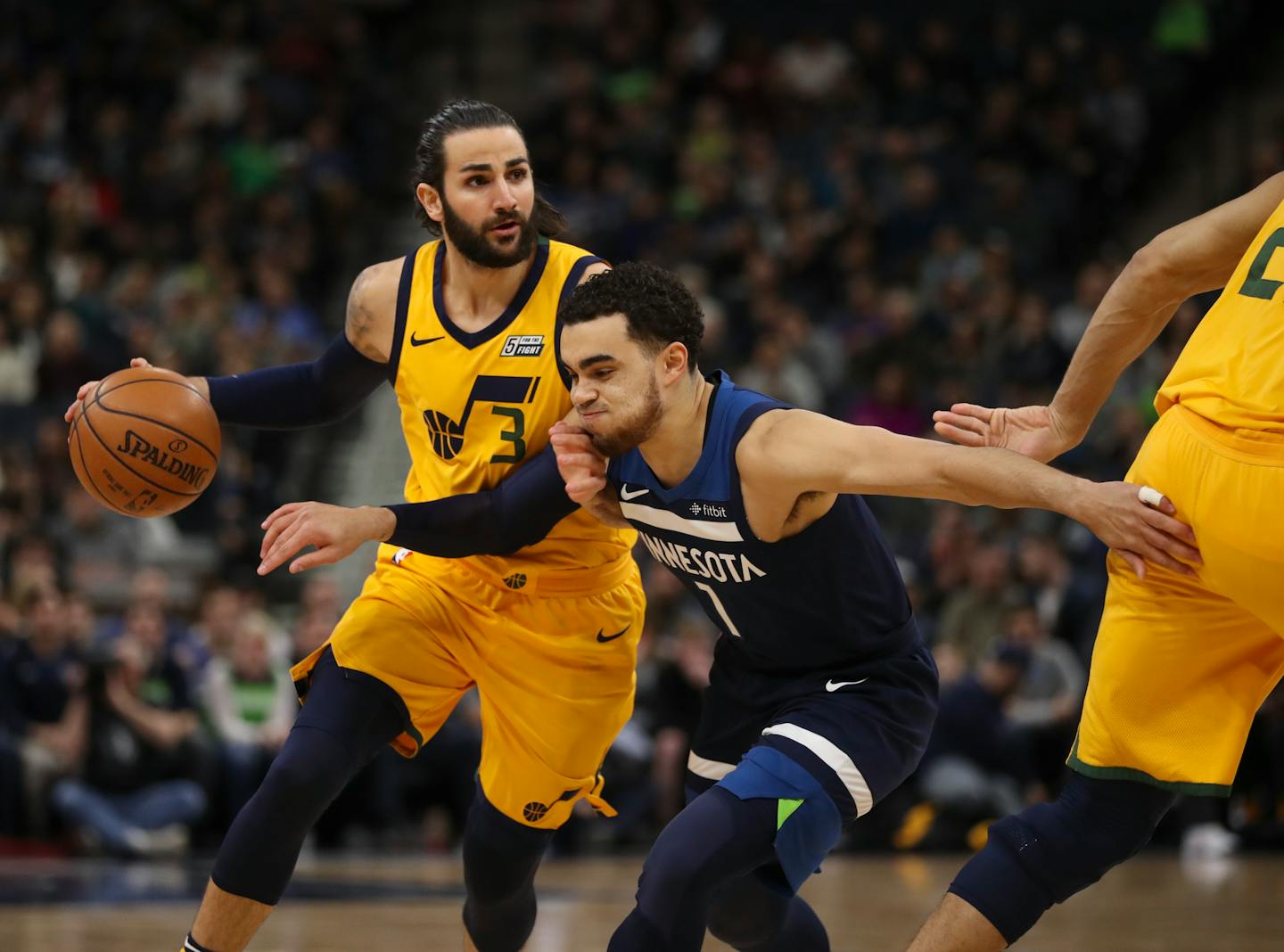 Utah Jazz guard Ricky Rubio (3) drove against Minnesota Timberwolves guard Tyus Jones (1) in the first quarter.