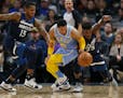 Minnesota Timberwolves guard Jimmy Butler (23) stole the ball from Los Angeles Lakers guard Jordan Clarkson (6) in the second quarter Monday night. At